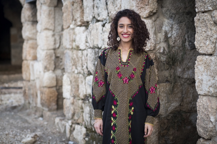 A dress is more than just a piece of clothing, it seems, especially if it is antique and carries the history and struggle of an entire nation, the hard work of women, and great happiness. Photo by Oren Ziv